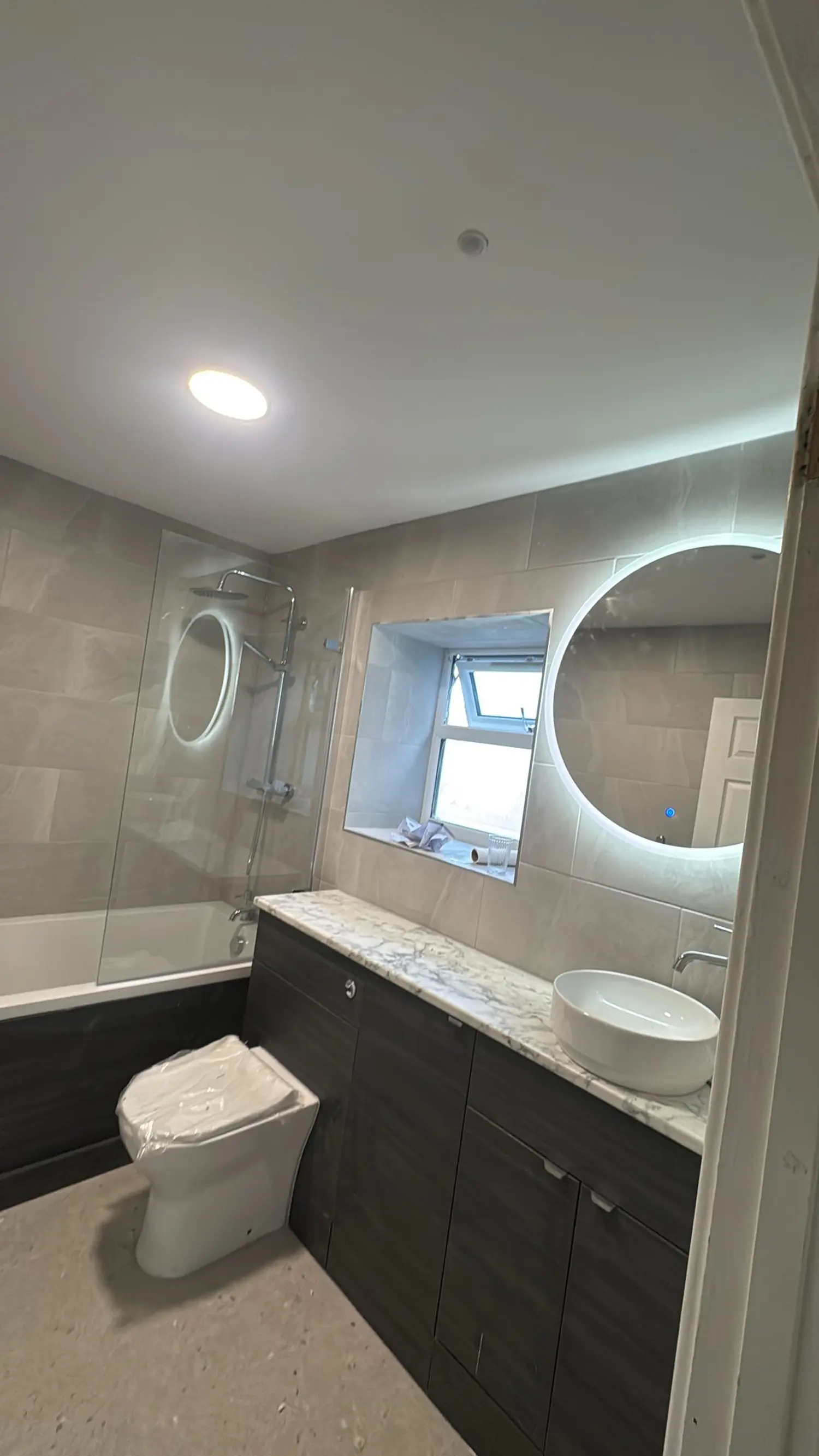 Bathroom rewire with IP-rated zone lighting and backlit demist mirror