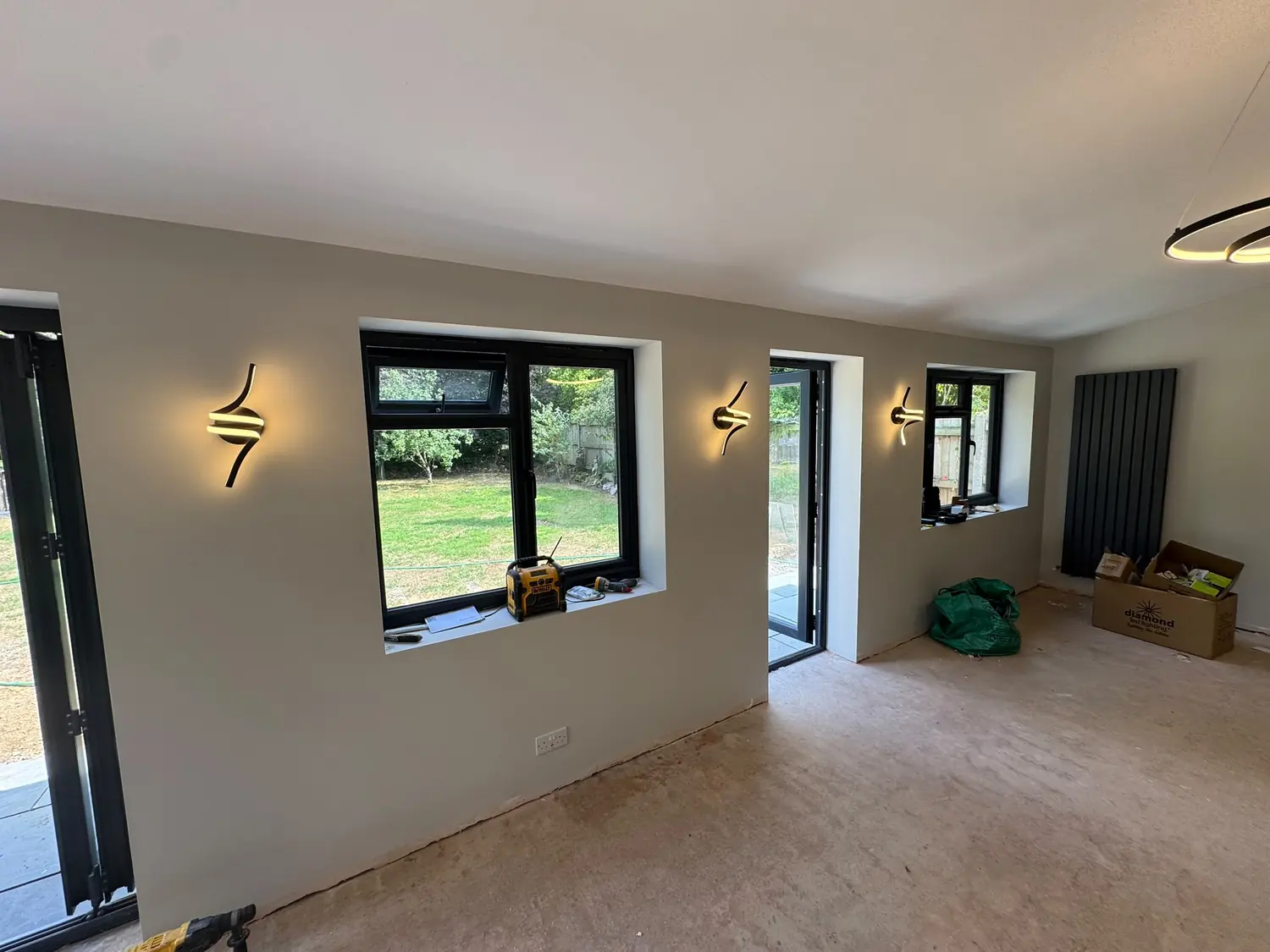 Feature wall lights set out along the wall in a Berkshire extension
